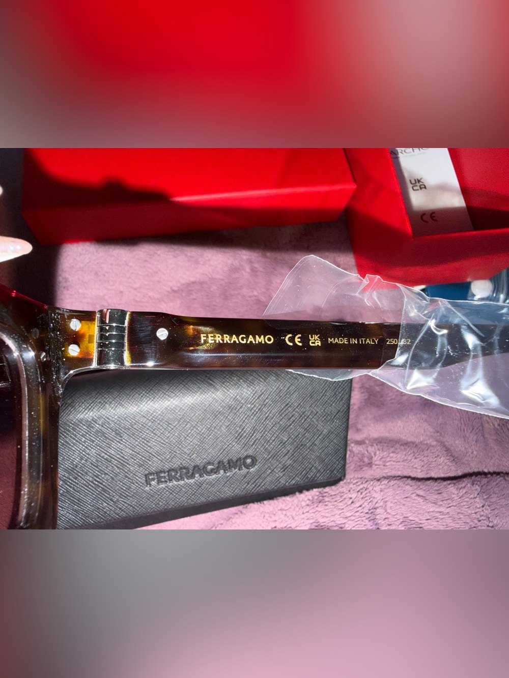 Salvatore Ferragamo Black Sunglasses with Gold Logo Detailing.